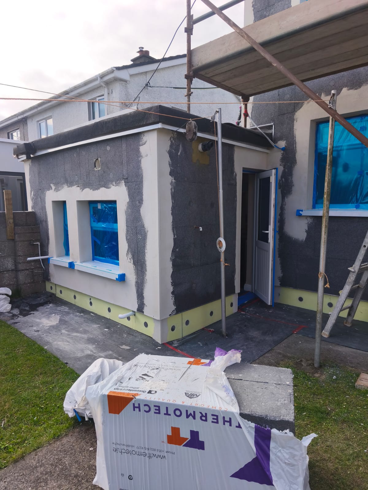 Extension EWI basecoat on scaffold